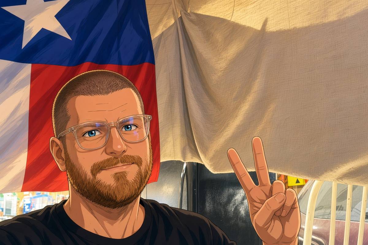 Joseph Burt at home in Texas, with the Texas flag behind him.
